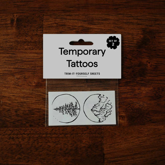Temporary tattoos on a wooden surface with a label indicating 'Temporary Tattoos'.